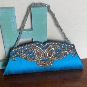 Embroidered clutch